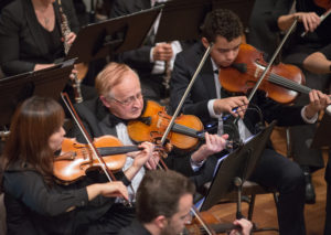 Photograph of the second violin section.