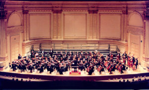 Historical photograph of the Ridgewood Symphony Orchestra performing at Carnegie Hall.