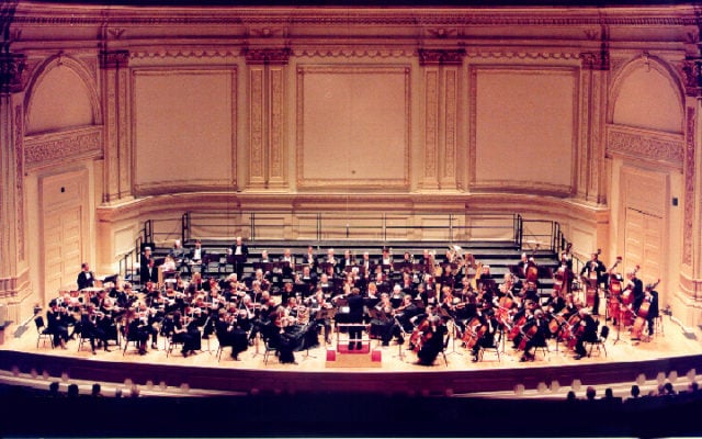 Historical photograph of the Ridgewood Symphony Orchestra performing at Carnegie Hall.